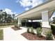 Community mailboxes under a covered structure surrounded by lush landscaping and trees at 15133 Summer Harvest St, Winter Garden, FL 34787