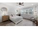 Bright primary bedroom featuring neutral decor, carpet, ceiling fan and natural light at 15133 Summer Harvest St, Winter Garden, FL 34787