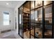 Modern office space with stylish glass walls, built-in shelving, and a sophisticated design at 15133 Summer Harvest St, Winter Garden, FL 34787
