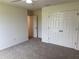 Bright bedroom features a closet, neutral walls, and plush carpeting for a cozy and inviting space at 1588 Sky Lakes Dr, St Cloud, FL 34769
