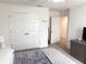 Bright bedroom features a large closet, neutral walls, and plush carpeting for a cozy and inviting space at 1588 Sky Lakes Dr, St Cloud, FL 34769