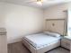 Clean and modern bedroom with plush carpeting, natural light and simple decor at 1588 Sky Lakes Dr, St Cloud, FL 34769