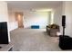 Open bonus room area with neutral carpet and decor, creating a versatile space at 1588 Sky Lakes Dr, St Cloud, FL 34769
