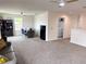 Spacious bonus room features a cozy seating area, a home office setup, and a convenient laundry closet at 1588 Sky Lakes Dr, St Cloud, FL 34769