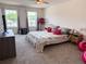 Bright main bedroom featuring cozy decor, large windows, and comfortable layout at 1588 Sky Lakes Dr, St Cloud, FL 34769