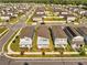 Aerial shot showing homes in a community with landscaped yards and neighborhood streets at 172 S Zuni Rd, St Cloud, FL 34771