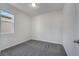 Neutral bedroom featuring carpeted floor and a window bringing in natural light at 172 S Zuni Rd, St Cloud, FL 34771