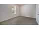 Bright bedroom showcasing wood-look flooring, ample natural light, and a neutral color palette for a comfortable space at 172 S Zuni Rd, St Cloud, FL 34771