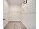 Walk-in closet with shelving, offering ample storage space and organization for a tidy and efficient lifestyle at 172 S Zuni Rd, St Cloud, FL 34771