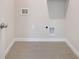 Laundry room with connections for washing machine and dryer, and tiled floors at 172 S Zuni Rd, St Cloud, FL 34771
