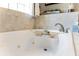 Bathroom featuring soaking tub with caddy and chrome fixtures, creating a luxurious spa-like experience at 174 Promenade Cir, Lake Mary, FL 32746