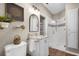 Bathroom featuring a glass shower stall, vanity, and updated fixtures at 174 Promenade Cir, Lake Mary, FL 32746