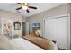 Bedroom with a view of a bathroom and closet, featuring a TV, and neutral decor that creates a serene atmosphere at 174 Promenade Cir, Lake Mary, FL 32746
