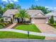 Well-maintained home with a tile roof, two-car garage, and beautiful landscaping enhances its exterior appeal at 174 Promenade Cir, Lake Mary, FL 32746