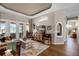 Spacious living room with beautiful wood floors, stylish furnishings, and a cozy atmosphere at 174 Promenade Cir, Lake Mary, FL 32746