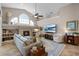 Inviting living room with a fireplace, stylish decor, and tile flooring at 174 Promenade Cir, Lake Mary, FL 32746