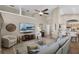 Spacious living room with vaulted ceilings, tile floors, and open floor plan at 174 Promenade Cir, Lake Mary, FL 32746