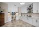 Office featuring tiled floor, white cabinets and drawers, and a comfortable chair at 174 Promenade Cir, Lake Mary, FL 32746
