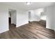 Inviting living room with hardwood floors, neutral walls, and an open layout, perfect for entertaining and relaxing at 1793 Western Hills Ln # N, Mascotte, FL 34753