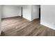 Bright living space boasting wood-look floors and fresh, neutral paint tones at 1793 Western Hills Ln # N, Mascotte, FL 34753
