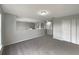 Spacious upstairs loft area with neutral carpeting, perfect for a media room, play area, or home office at 1793 Western Hills Ln # N, Mascotte, FL 34753