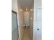 Narrow bathroom featuring a toilet, towel rack, and tiled floors, offering functionality in a compact space at 1984 Estancia Circle # 29A, Kissimmee, FL 34741