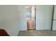 Clean bedroom with tile floor, leads to the bathroom with tub-shower combo at 1984 Estancia Circle # 29A, Kissimmee, FL 34741