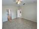 Bedroom features neutral walls, tile floors, and access to the bathroom at 1984 Estancia Circle # 29A, Kissimmee, FL 34741
