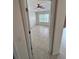 Inviting bedroom with tiled floors, a ceiling fan, and a bright window, creating a comfortable living space at 1984 Estancia Circle # 29A, Kissimmee, FL 34741