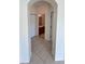 Hallway view showcasing tiled floors and doorways leading to the bathroom and closet, ensuring convenience and accessibility at 1984 Estancia Circle # 29A, Kissimmee, FL 34741