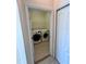 Convenient laundry room with a full-size washer and dryer and tile flooring at 1984 Estancia Circle # 29A, Kissimmee, FL 34741