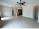 Open-concept living space with tile floors flows into the kitchen at 1984 Estancia Circle # 29A, Kissimmee, FL 34741
