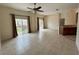 Bright living room with tile flooring and sliding doors to the outside at 1984 Estancia Circle # 29A, Kissimmee, FL 34741