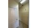 Functional walk-in closet featuring a white door and wire shelving, providing efficient storage solutions at 1984 Estancia Circle # 29A, Kissimmee, FL 34741