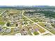 An aerial view of a neighborhood with well-maintained lawns and varied architectural styles at 205 Cimarron Dr, Kissimmee, FL 34759
