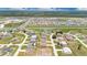 A neighborhood featuring a mix of home styles, surrounded by green spaces and community amenities at 205 Cimarron Dr, Kissimmee, FL 34759