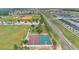 Aerial shot of community basketball courts, baseball field, and neighborhood at 205 Cimarron Dr, Kissimmee, FL 34759