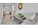 Bright entryway featuring wood-look floors, neutral paint, and a stylish mirror at 205 Cimarron Dr, Kissimmee, FL 34759