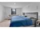 Serene main bedroom featuring a comfortable bed, soft lighting, and a large window at 205 Cimarron Dr, Kissimmee, FL 34759