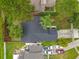 An aerial view showing the house, driveway, and Crepe Myrtle bushes at 2160 Churchill Downs Cir, Orlando, FL 32825