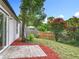 Backyard features a patio, landscaping, and privacy fence at 2160 Churchill Downs Cir, Orlando, FL 32825