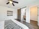Bedroom with a sliding barn door entry to the ensuite bathroom and walk-in closet at 2160 Churchill Downs Cir, Orlando, FL 32825
