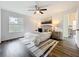 Comfortable bedroom with a ceiling fan and dark wood-look flooring, and ensuite bathroom at 2160 Churchill Downs Cir, Orlando, FL 32825