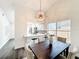Open dining area showcases modern lighting and a seamless connection to the kitchen at 2160 Churchill Downs Cir, Orlando, FL 32825