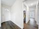 The entryway welcomes you with wood floors leading through hallways and a glimpse of a water heater at 2160 Churchill Downs Cir, Orlando, FL 32825