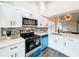 Modern kitchen featuring a stylish backsplash, sleek appliances, white countertops, and an open design at 2160 Churchill Downs Cir, Orlando, FL 32825