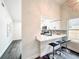 Stylish kitchen featuring sleek white cabinets, modern backsplash, and breakfast bar at 2160 Churchill Downs Cir, Orlando, FL 32825