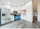 Modern kitchen with stainless steel appliances, white cabinets, and stylish backsplash, open to dining area at 2160 Churchill Downs Cir, Orlando, FL 32825