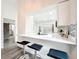 Kitchen bar featuring quartz countertops, modern fixtures, and a pass-through to the kitchen at 2160 Churchill Downs Cir, Orlando, FL 32825