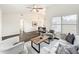 Spacious living room with wood floors, vaulted ceiling, and modern furnishings at 2160 Churchill Downs Cir, Orlando, FL 32825